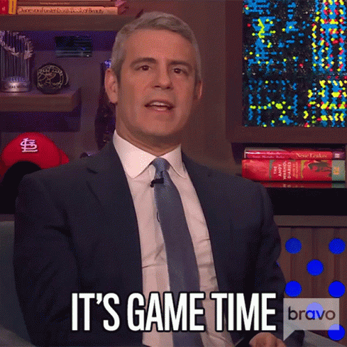 a man in a suit and tie says it 's game time on bravo