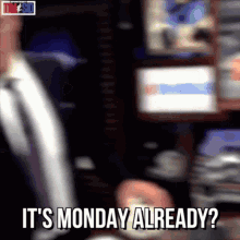 A Man In A Suit And Tie Says It 'S Monday Already . GIF