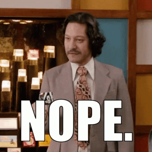 A Man In A Suit And Tie Says Nope In Front Of A Display Case GIF