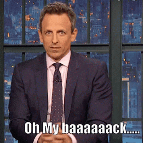 A Man In A Suit And Tie Says Oh My Baaaack GIF