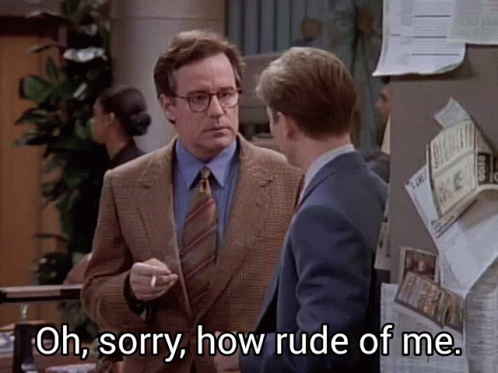A Man In A Suit And Tie Says Oh Sorry How Rude Of Me While Smoking A Cigarette GIF