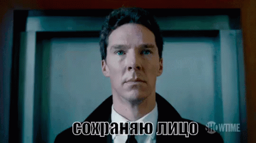 a man in a suit and tie says showtime on the bottom right