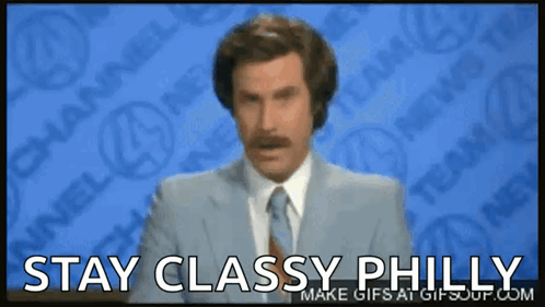 A Man In A Suit And Tie Says " Stay Classy Philly " On A Screen GIF