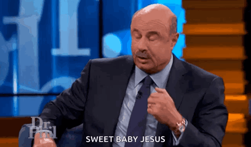 A Man In A Suit And Tie Says Sweet Baby Jesus On A Show GIF