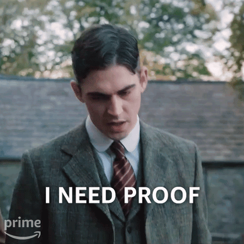 A Man In A Suit And Tie Says That He Needs Proof GIF