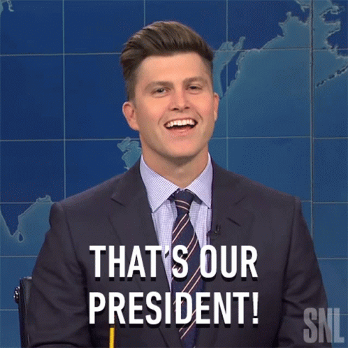 A Man In A Suit And Tie Says " That 'S Our President " While Holding A Pencil GIF