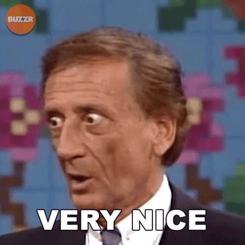 A Man In A Suit And Tie Says Very Nice In Front Of A Buzzr Logo GIF