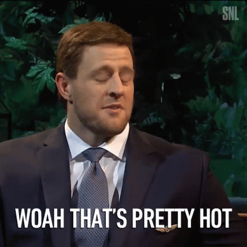 A Man In A Suit And Tie Says Woah That Is Pretty Hot GIF