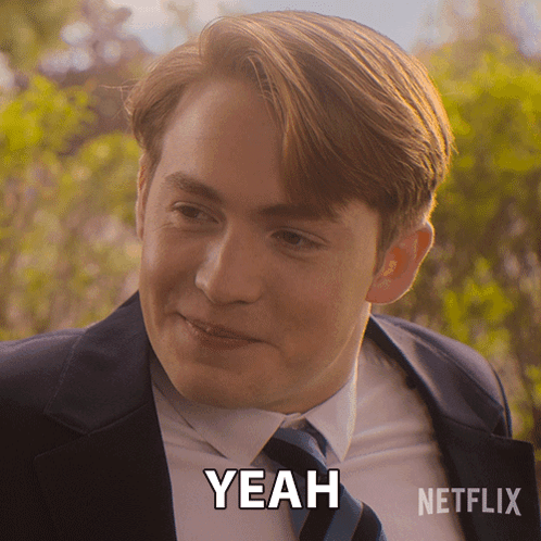 A Man In A Suit And Tie Says Yeah In A Netflix Advertisement GIF
