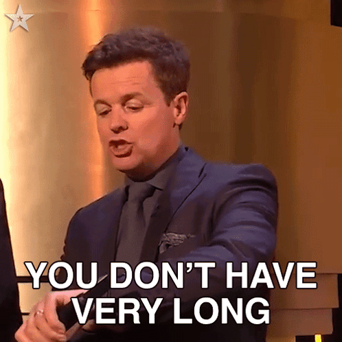 A Man In A Suit And Tie Says You Don T Have Very Long GIF