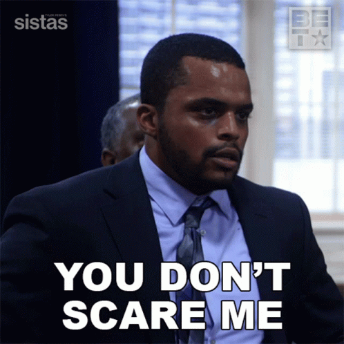 A Man In A Suit And Tie Says You Don T Scare Me GIF