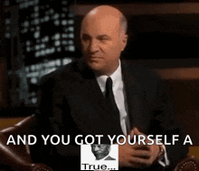 A Man In A Suit And Tie Sitting In A Chair With The Words " And You Got Yourself A True " On The Bottom GIF