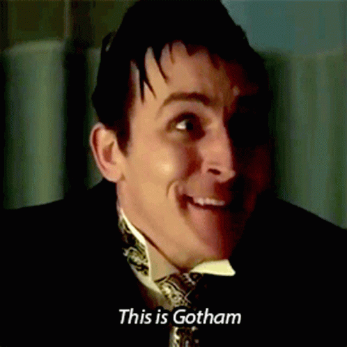 A Man In A Suit And Tie Smiles And Says This Is Gotham GIF