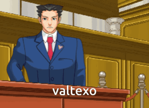 A Man In A Suit And Tie Stands At A Podium With The Word Valtexo Written Below Him GIF