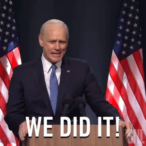 Man In Suit And Tie At Podium Saying We Did It GIF