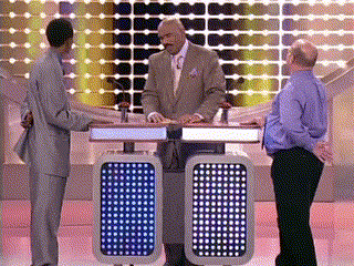 A Man In A Suit And Tie Stands In Front Of A Podium With A Blue Light On It That Says 00 GIF