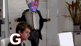 A Man In A Suit And Tie Stands In Front Of A White Board That Says Get The I On It GIF