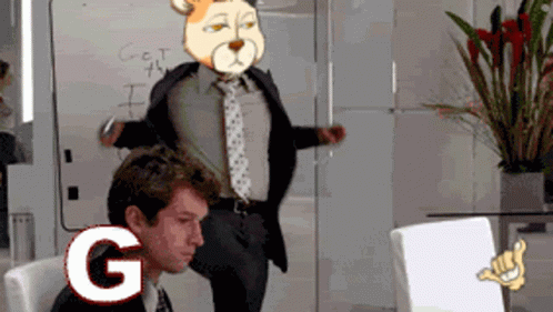 A Man In A Suit And Tie Stands In Front Of A White Board That Says Get The I On It GIF