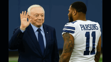 A Man In A Suit And Tie Waves To A Man In A Number 11 Parsons Jersey GIF