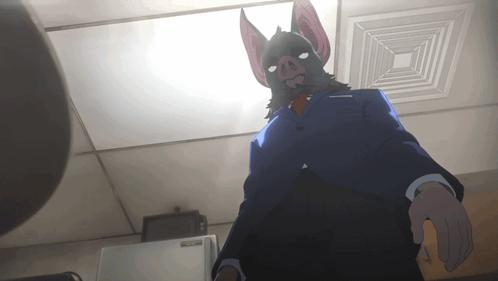 A Man In A Suit And Tie With A Bat Mask On GIF