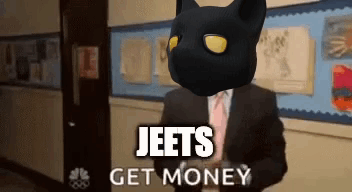 A Man In A Suit And Tie With A Black Cat On His Head And The Words Jeets Get Money Above Him GIF