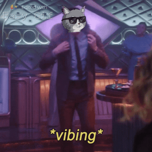 A Man In A Suit And Tie With A Cat On His Head And The Word Vibing GIF