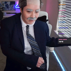 A Man In A Suit And Tie With A Fake Mustache GIF