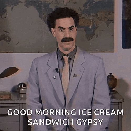 A Man In A Suit And Tie With A Mustache Says Good Morning Ice Cream Sandwich Gypsy GIF