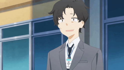 A Man In A Suit And Tie With A Name Tag That Says ' Aoi ' On It GIF