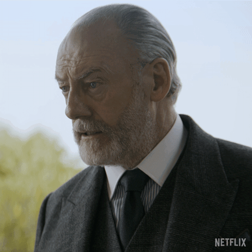Man In Suit With Netflix Logo GIF