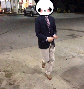 A Man In A Suit And Tie With A Panda Face On His Face GIF