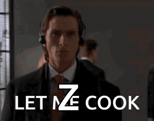A Man In A Suit And Tie With Headphones On Says Let Me Cook GIF