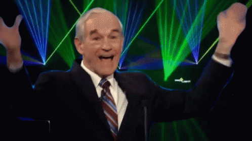 A Man In A Suit And Tie With His Arms In The Air And The Words It 'S Happening Above Him GIF