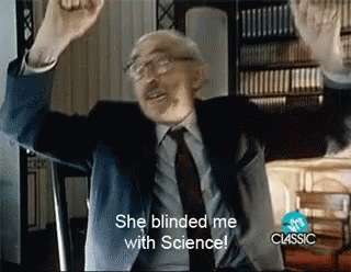 A Man In A Suit And Tie With His Arms In The Air Says She Blinded Me With Science GIF