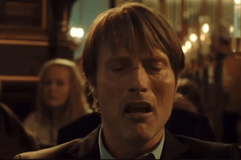 A Man In A Suit And Tie With His Mouth Open GIF