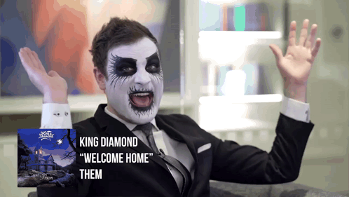 A Man In A Suit And Tie With King Diamond Welcome Home Them Written On The Bottom GIF