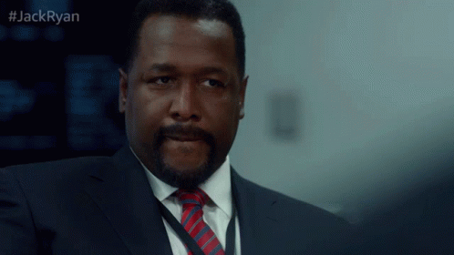 A Man In A Suit And Tie With The Hashtag Jackryan GIF