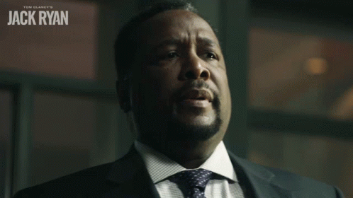 A Man In A Suit And Tie With The Name Jack Ryan On The Top GIF