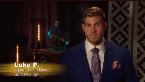 A Man In A Suit And Tie With The Name Luke P. GIF