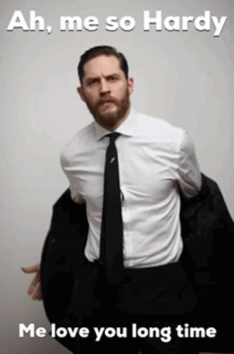 A Man In A Suit And Tie With The Words Ah Me So Hardy Me Love You Long Time Below Him GIF