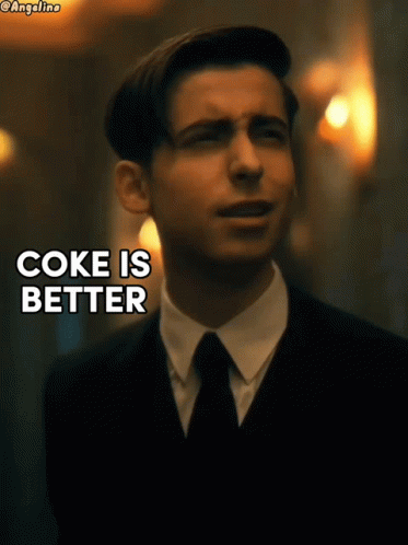 A Man In A Suit And Tie With The Words Coke Is Better GIF