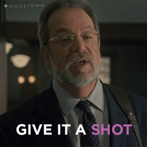 A Man In A Suit And Tie With The Words Give It A Shot Below Him GIF