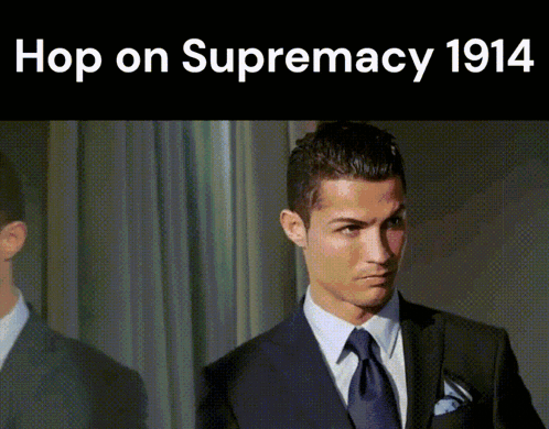 A Man In A Suit And Tie With The Words Hop On Supremacy 1914 Below Him GIF