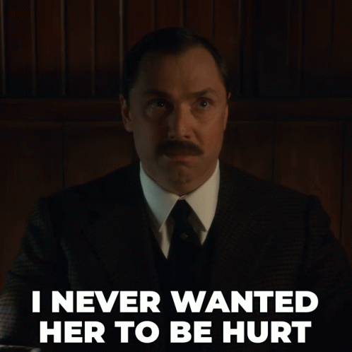A Man In A Suit And Tie With The Words I Never Wanted Her To Be Hurt Below Him GIF