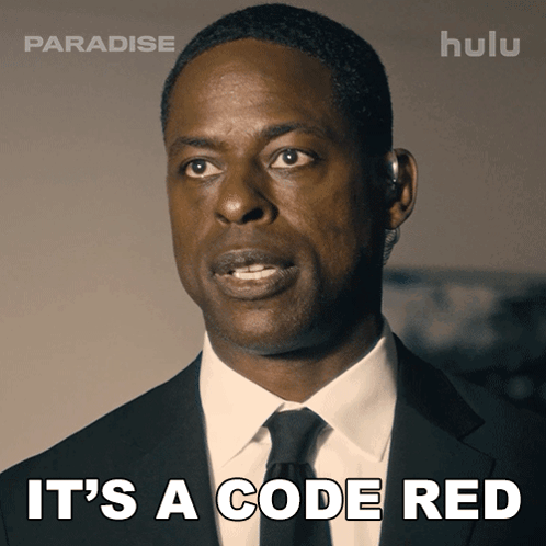 A Man In A Suit And Tie With The Words It 'S A Code Red GIF