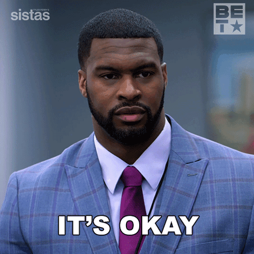 A Man In A Suit And Tie With The Words It 'S Okay Below Him GIF