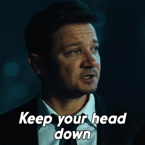 A Man In A Suit And Tie With The Words Keep Your Head Down GIF
