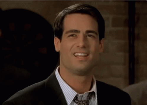 A Man In A Suit And Tie With The Words Prove It Above Him GIF