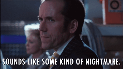 A Man In A Suit And Tie With The Words Sounds Like Some Kind Of Nightmare Below Him GIF