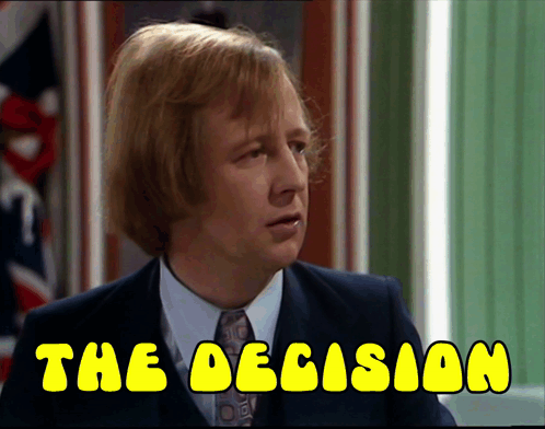A Man In A Suit And Tie With The Words " The Decision " Below Him GIF